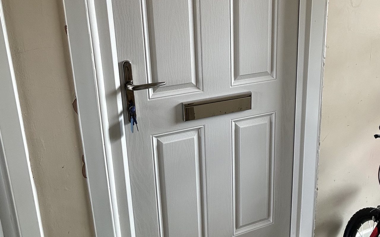 Composite front door with lock, handle and letterplate fitted by Craft Solutions Essex